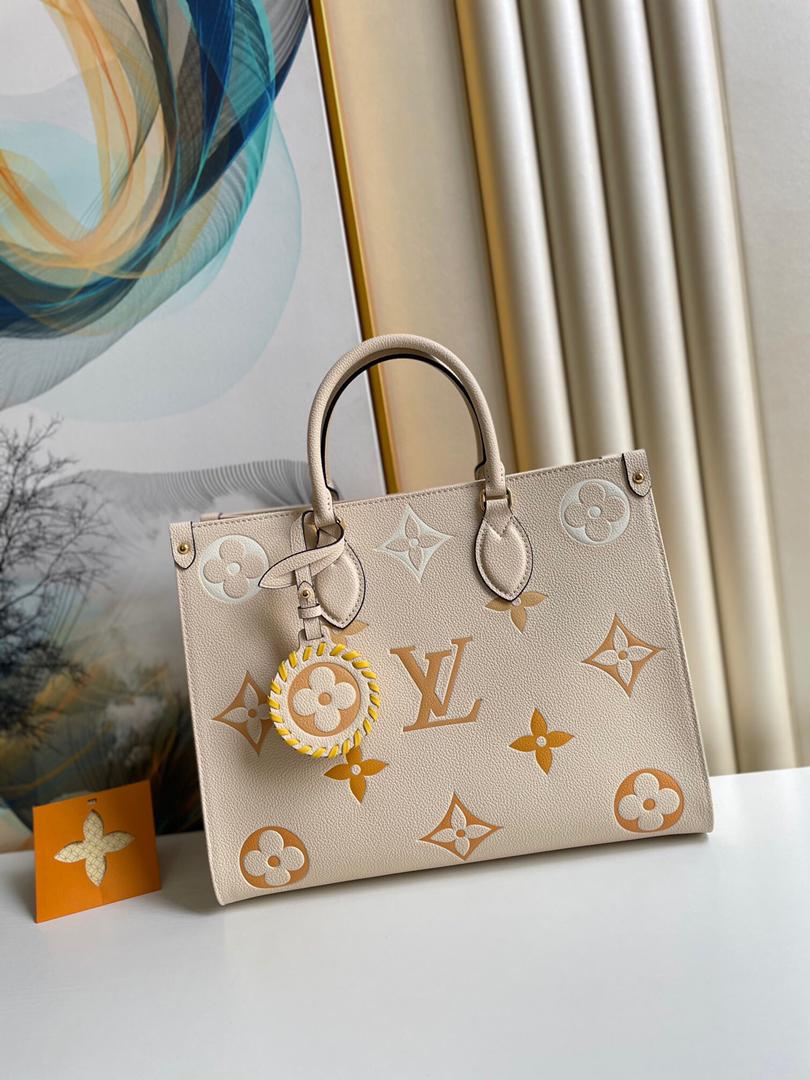 Cream and grey louis vuitton bag hotsell